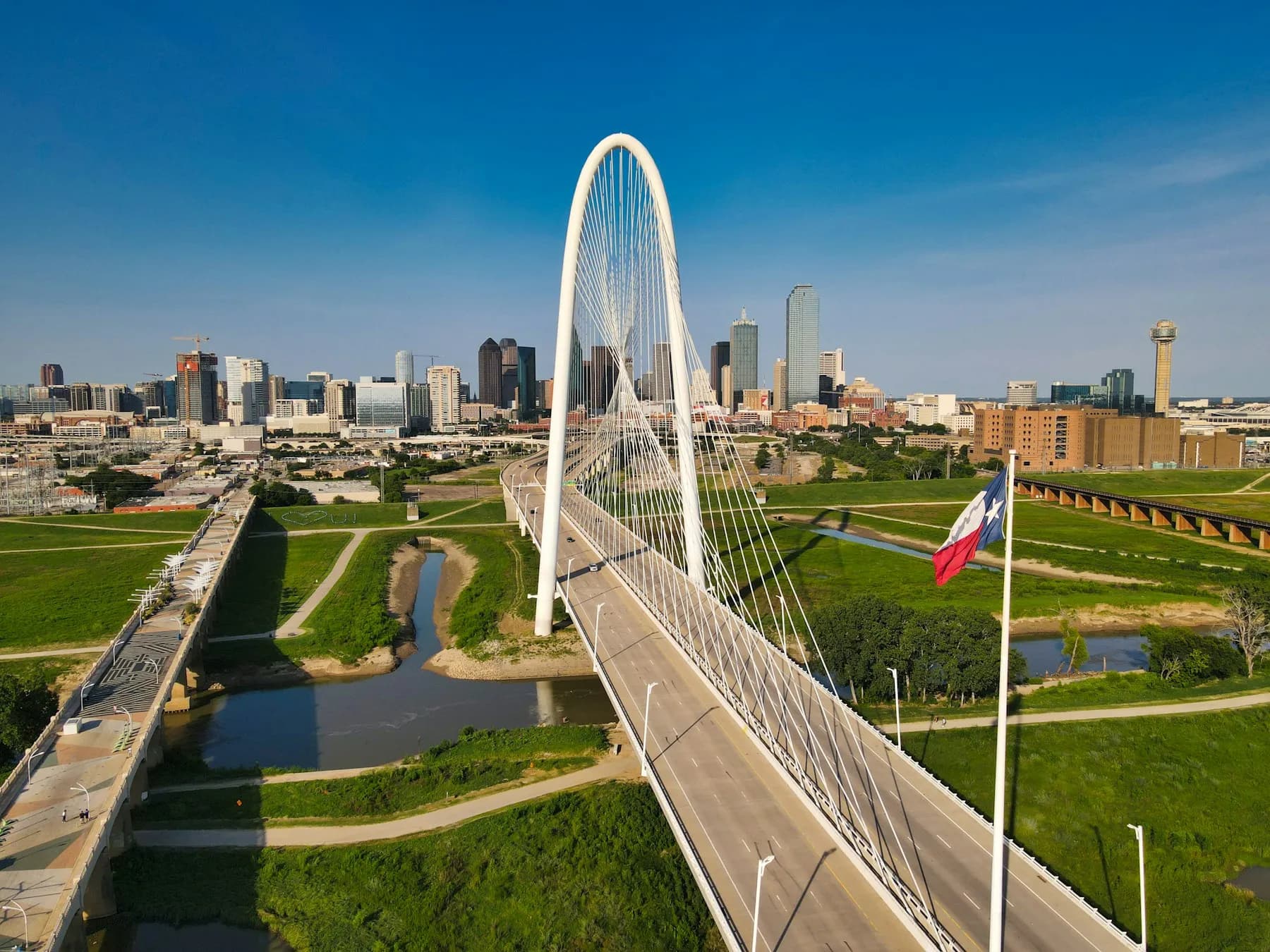 Margaret Hunt Hill Bridge crossing toward the downtown Dallas skyline