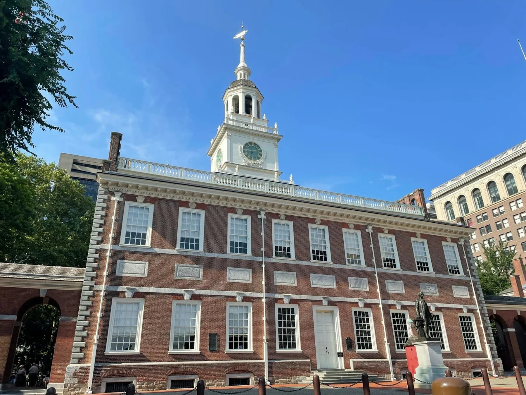 Independence Hall and its clock tower under a blue Philadelphia sky