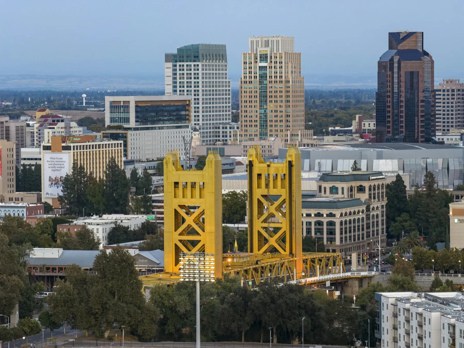 Sacramento's yellow Tower Bridge with the downtown skyline behind it