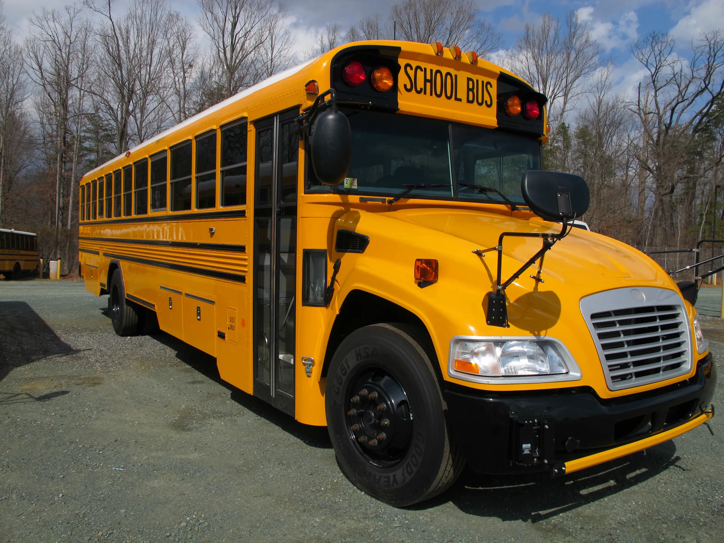 Yellow Blue Bird Vision school bus photographed outdoors