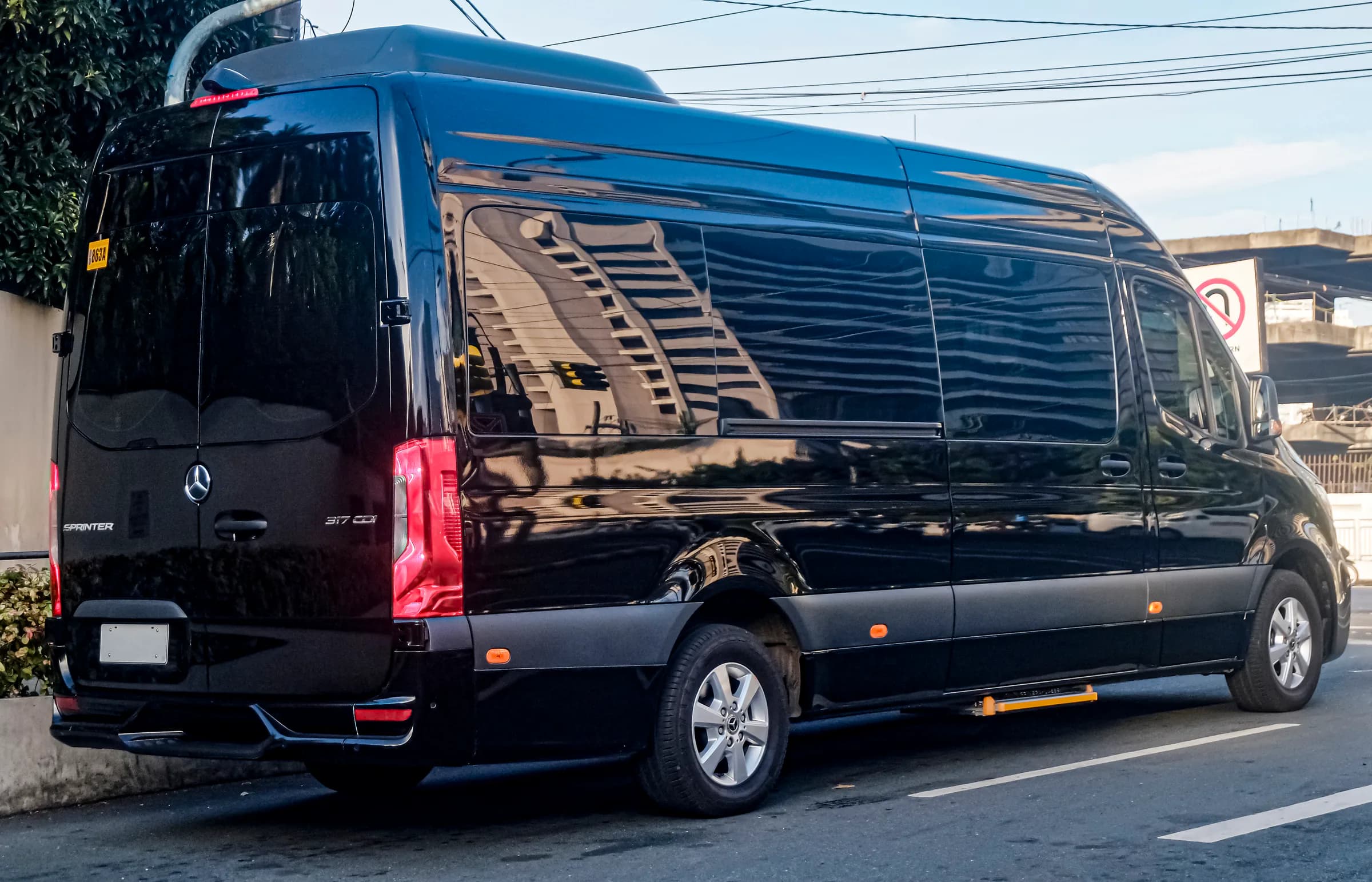 Black Mercedes-Benz Sprinter luxury passenger van